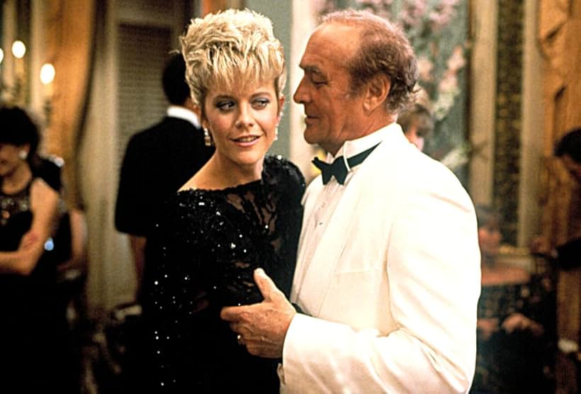 Meg Ryan and Robert Loggia in Armed and Dangerous (1986)