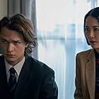 Rinko Kikuchi and Ansel Elgort in I Want It That Way (2022)