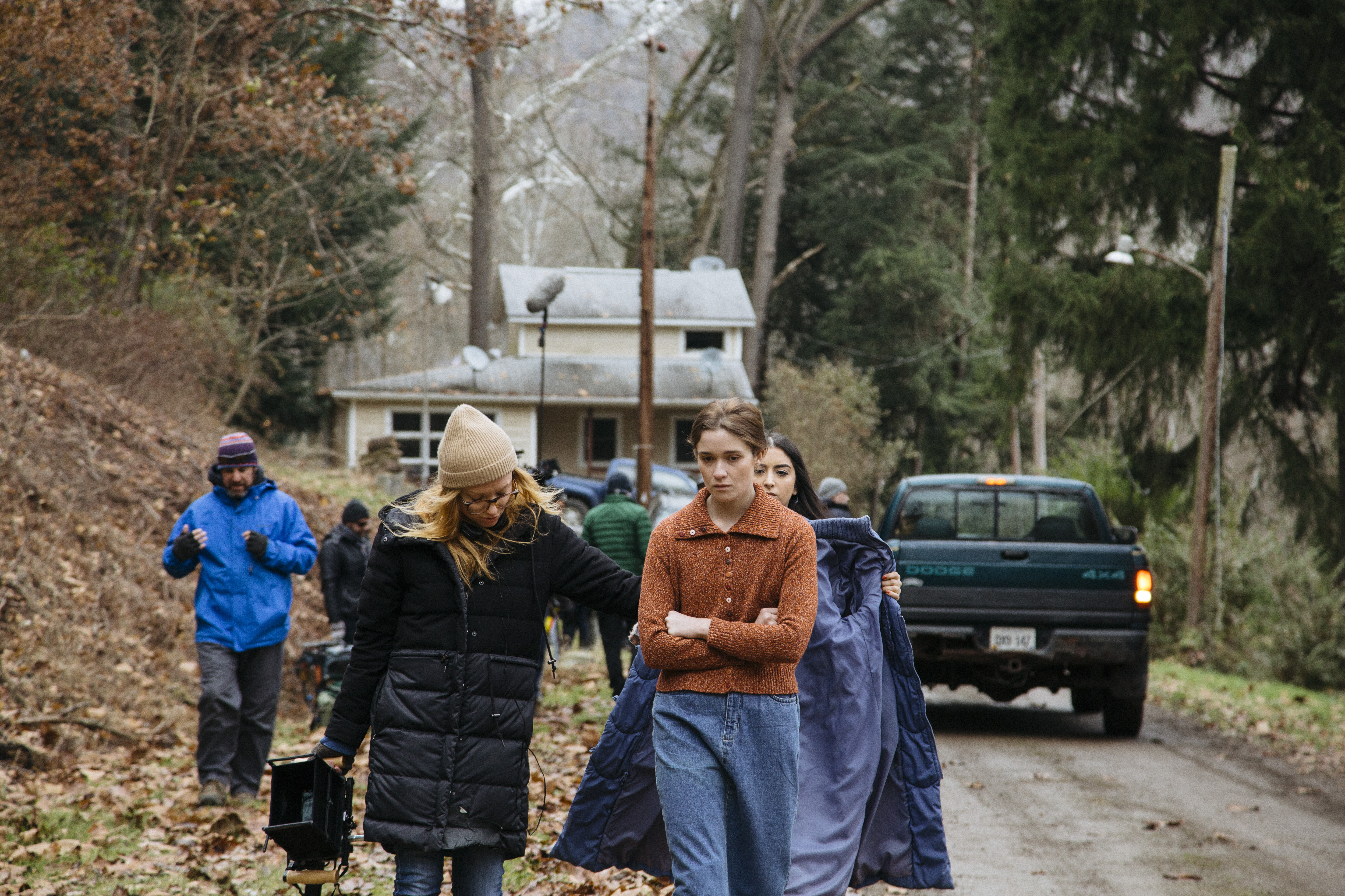 Director Britt Poulton walking with actress Alice Englert on the set of Them That Follow