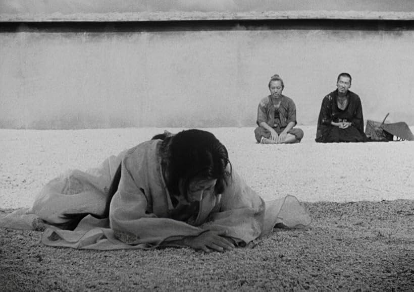 Minoru Chiaki, Machiko Kyô, and Takashi Shimura in Rashomon (1950)