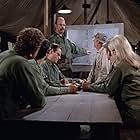 Alan Alda, Gary Burghoff, Graham Jarvis, Larry Linville, Wayne Rogers, McLean Stevenson, and Loretta Swit in M*A*S*H (1972)