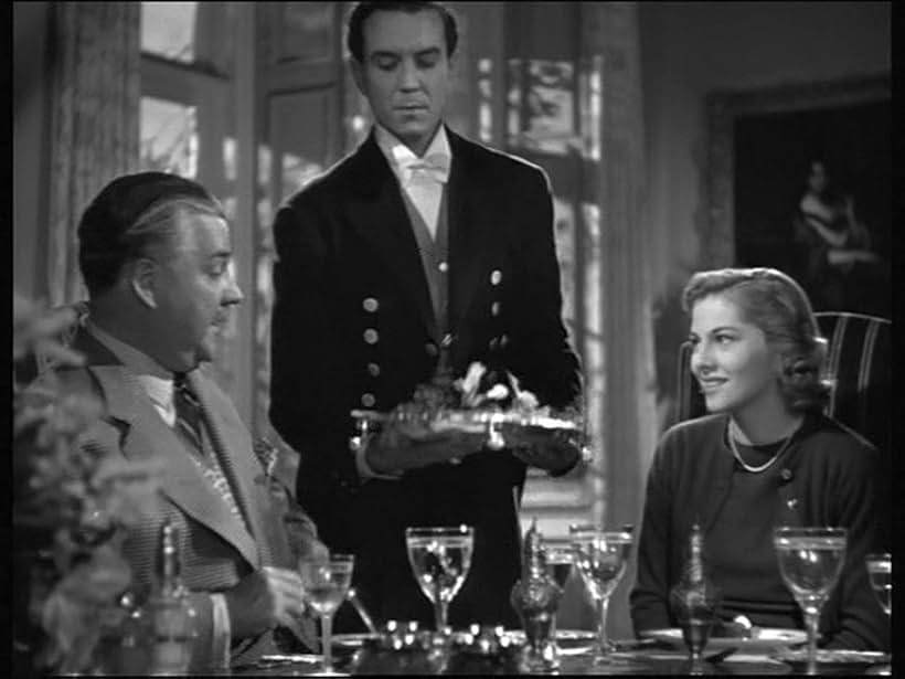 Joan Fontaine, Nigel Bruce, and Philip Winter in Rebecca (1940)