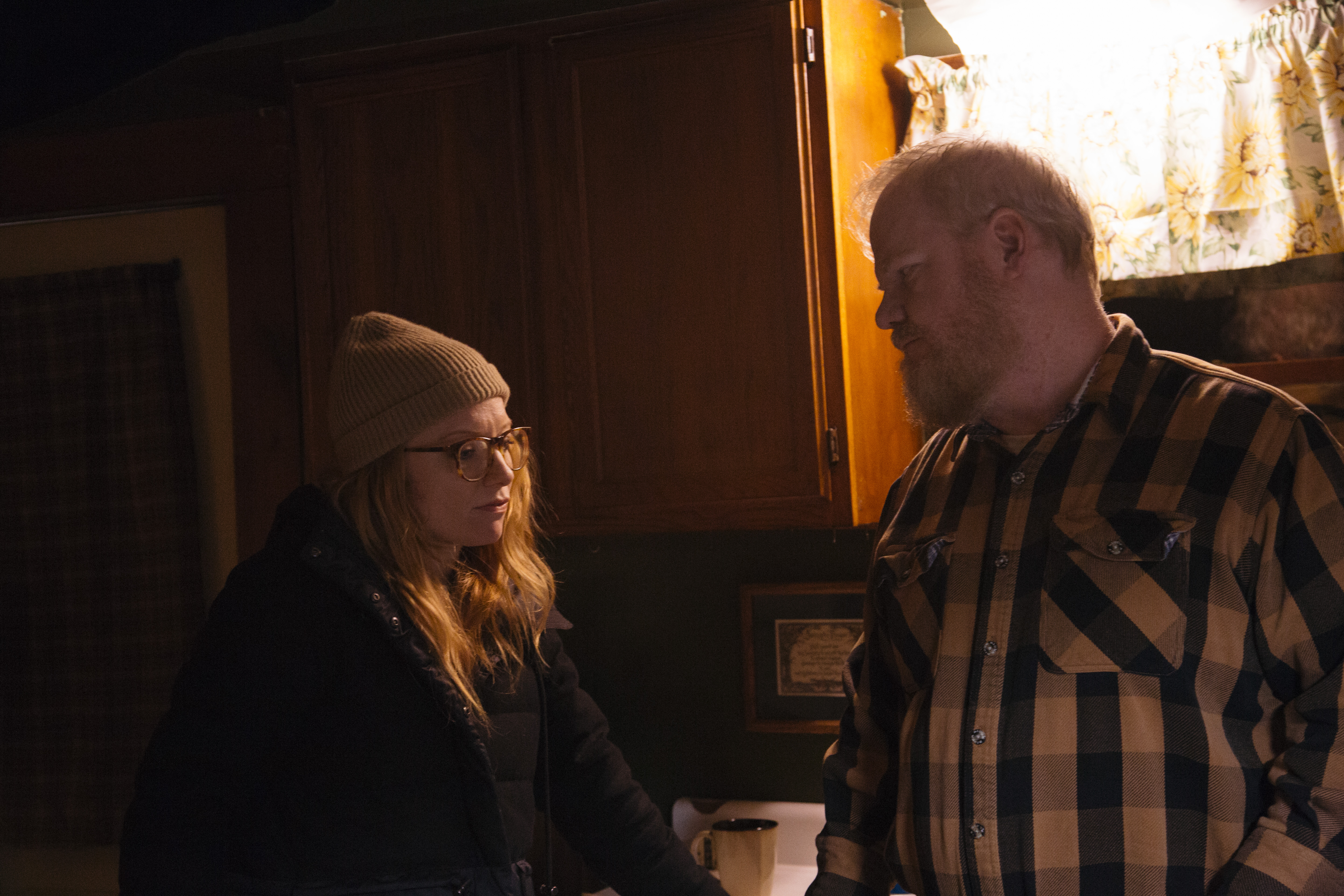 Director Britt Poulton talking to actor Jim Gaffigan on the set of Them That Follow