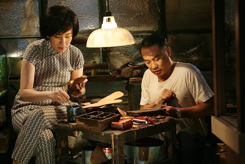 Sandra Kwan Yue Ng and Simon Yam in Echoes of the Rainbow (2010)