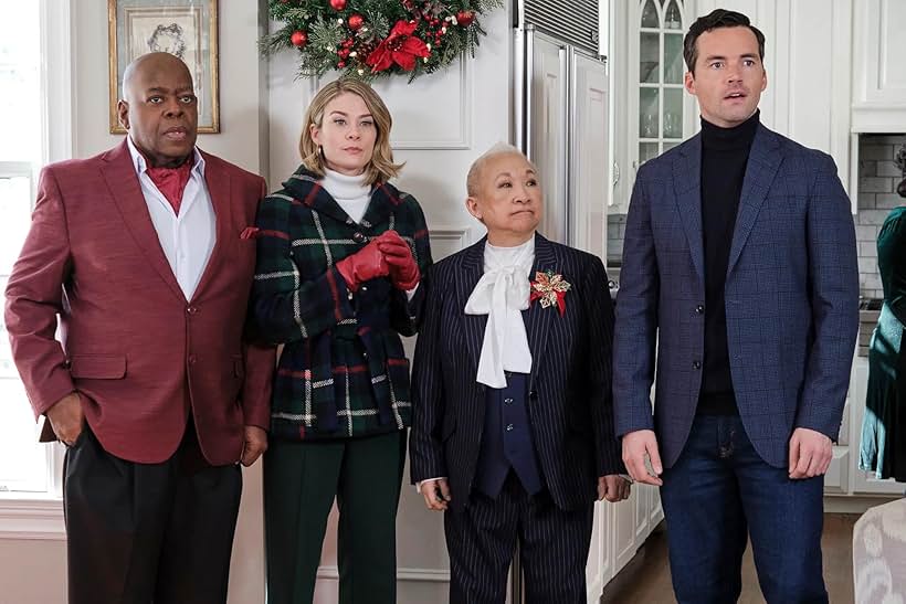 Reginald VelJohnson, Lori Tan Chinn, Kim Matula, and Ian Harding in Ghosts of Christmas Always (2022)