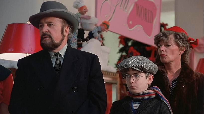 Leigh Brown, Jordan-Patrick Marcantonio, and Jean Shepherd in A Christmas Story (1983)