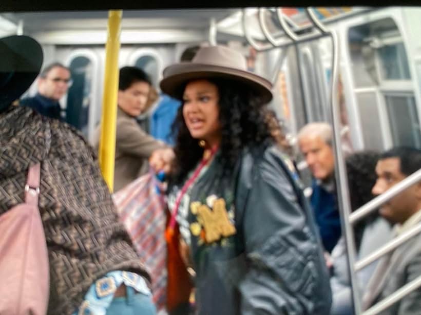 Michelle bureau with me in the subway scene Survival of the Thickest. Netflix.