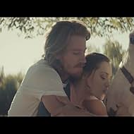 Garrett Hedlund and Kerry Knuppe in Kings of Leon: Beautiful War (2013)