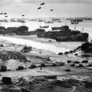 Beaches are filled with soldiers and attack boats and vehicles during the Invasion of Normandy 