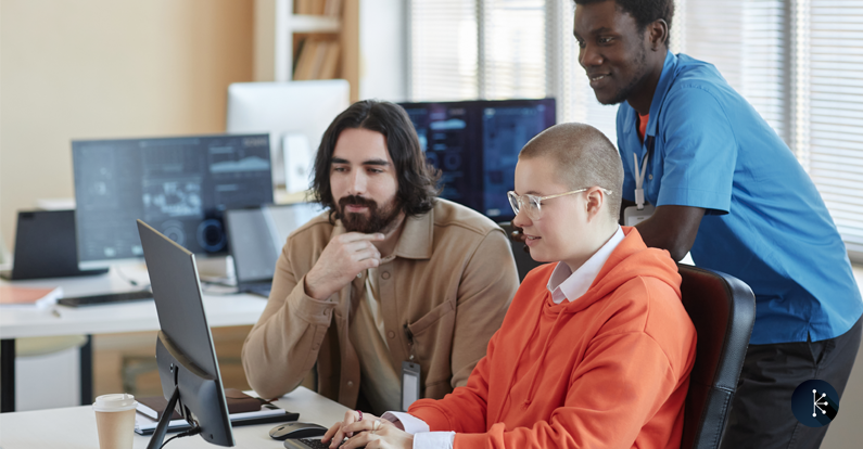 Mariner - Microsoft - Young businesswoman typing while her two colleagues looking at screen