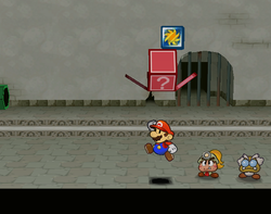 Screenshot of Mario revealing a hidden ? Block (containing a Pretty Lucky badge) in Rogueport Sewers, in Paper Mario: The Thousand-Year Door.