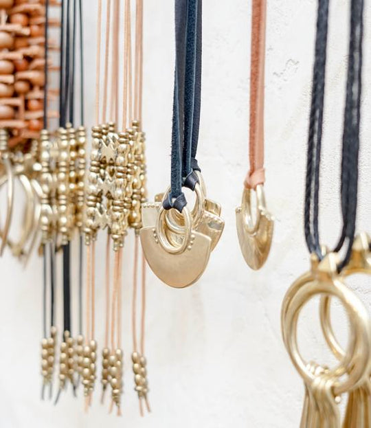 Marisa Mason necklaces hanging on wall