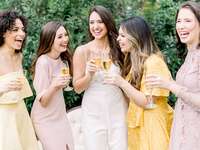 women drinking champagne with bride at bridal shower