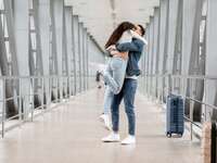 Couple hugging airport long distance relationship 