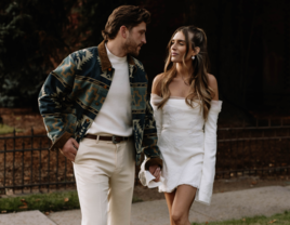 Couple looking at each other holding hands in the fall