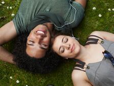 Young couple sharing headphones