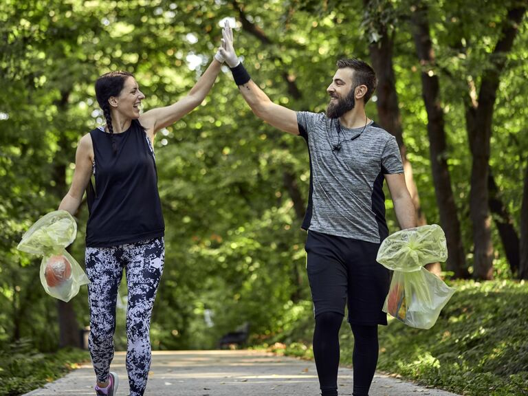 Couple high five after volunteering. 