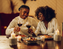 Couple enjoying dinner together with wine