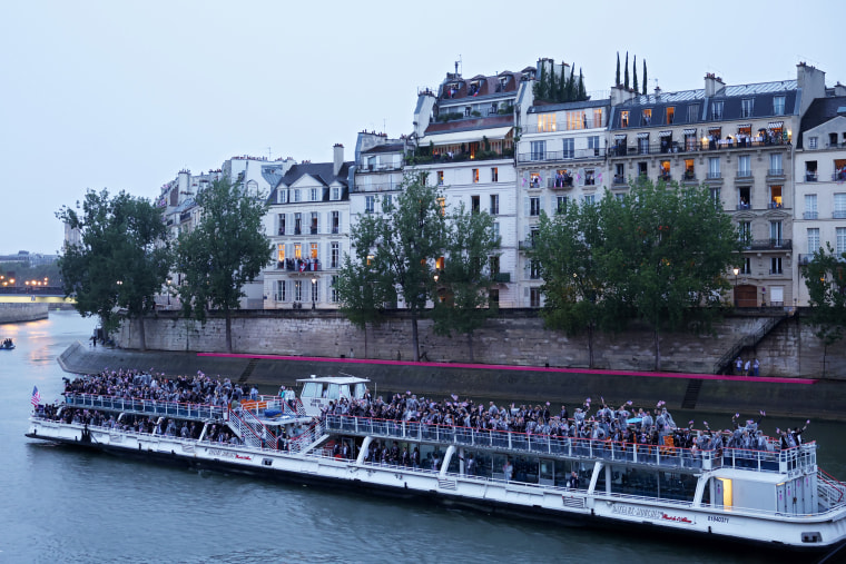 Team United States of America cruise during the athletes parade on the River Seine during the opening ceremony.