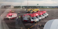 Ambulances next to an Air Europa Boeing 787-9 Dreamliner after it made an emergency landing in Natal, in northern Brazil, on July 1, 2024, after hitting strong turbulence on its way from Madrid to Montevideo. 