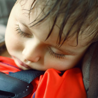 Toddler sleeping in a dangerously hot car