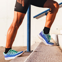 Close up of calves while stretching.