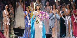 Sheynnis Palacios holds a large bouquet of flowers after being crowned
