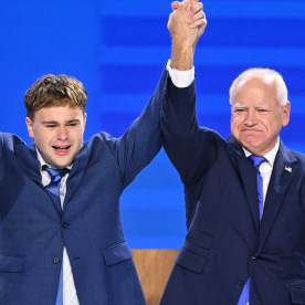 Tim Walz stands onstage with his daughter Hope (L), son Gus (2L) and wife Gwen Walz (R) after he spoke on the third day of the Democratic National Convention (DNC) in Chicago on Aug. 21, 2024.