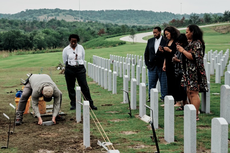 Victor Honey's family attends a burial service.