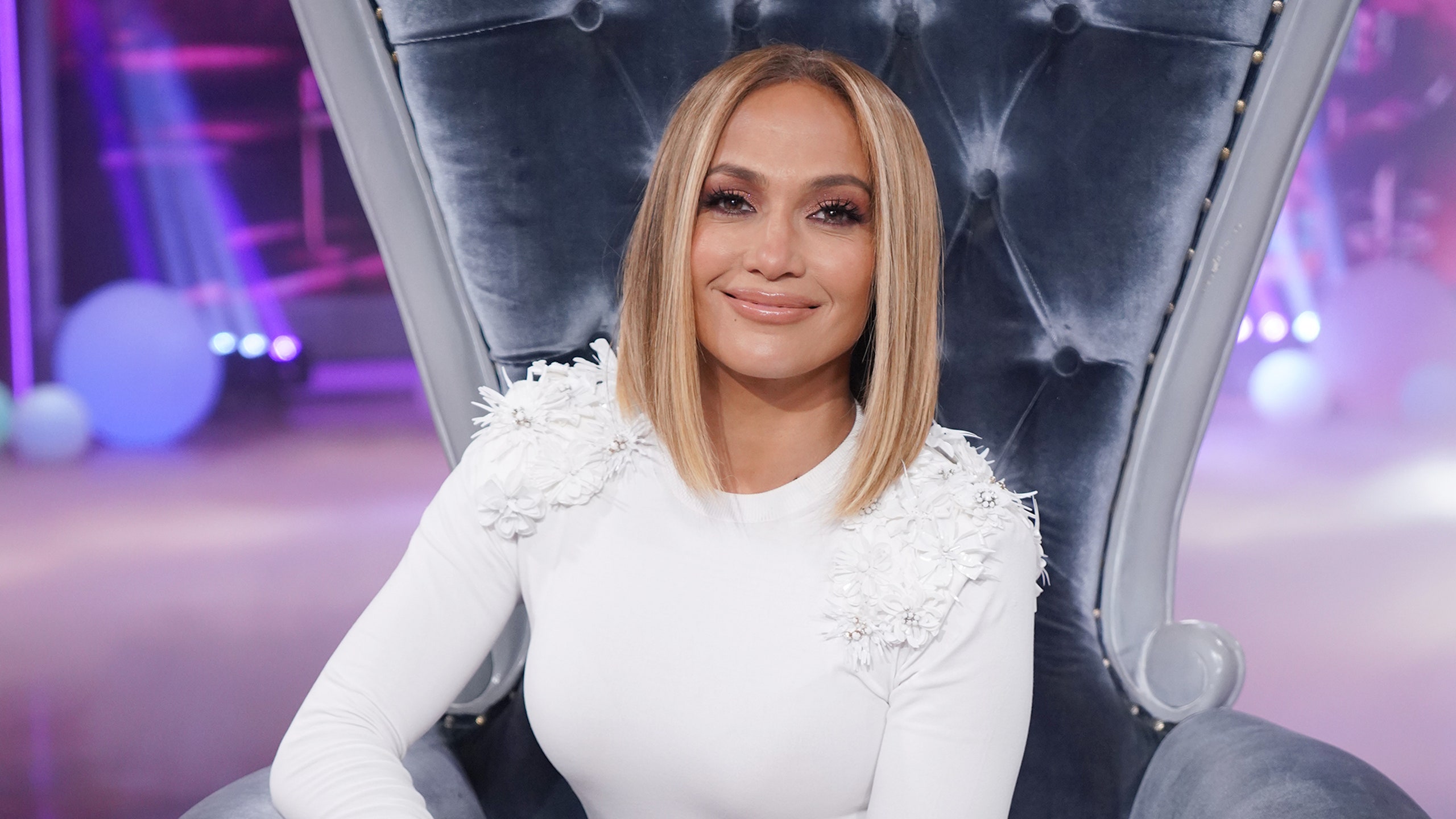 Jennifer Lopez in a white sweater and long bob