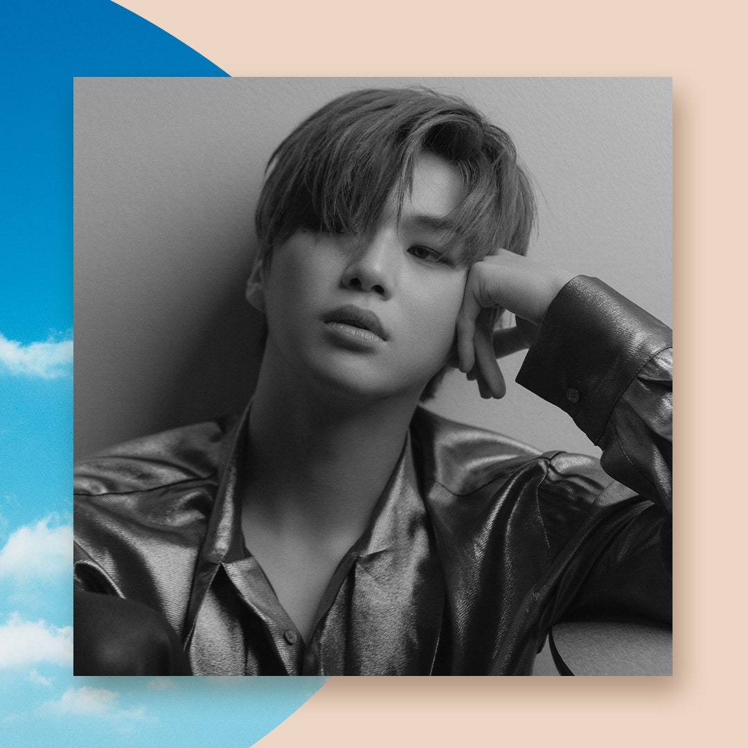 Kang Daniel wearing metallic button down in press shot.