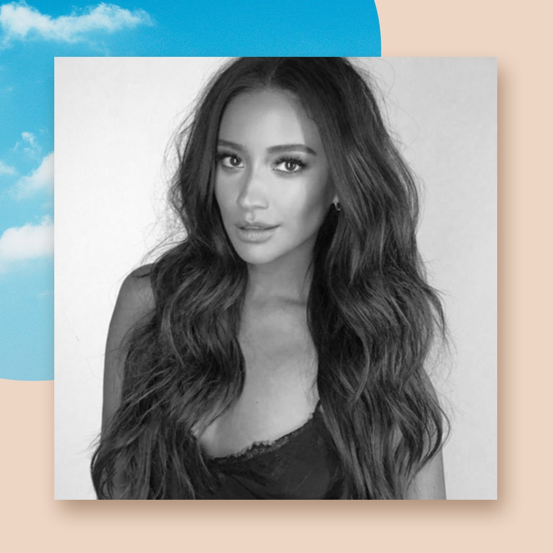 Shay Mitchell wearing lace camisole in press photo.