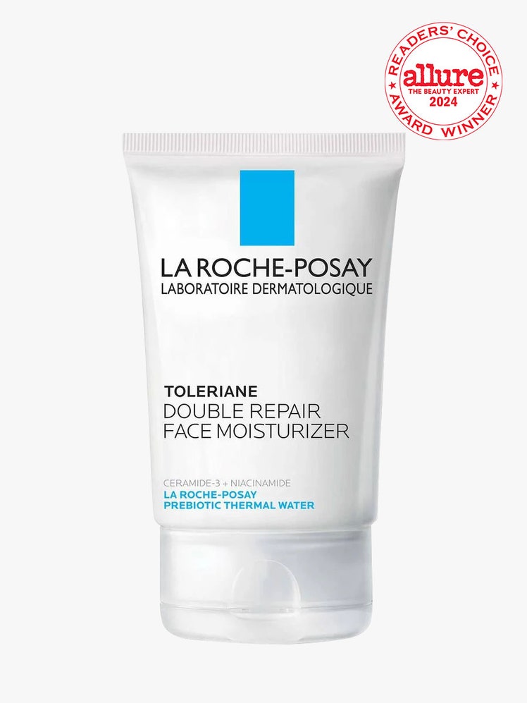 La RochePosay Toleriane Double Repair Face Moisturizer flat white tube of moisturizer on light gray background with...