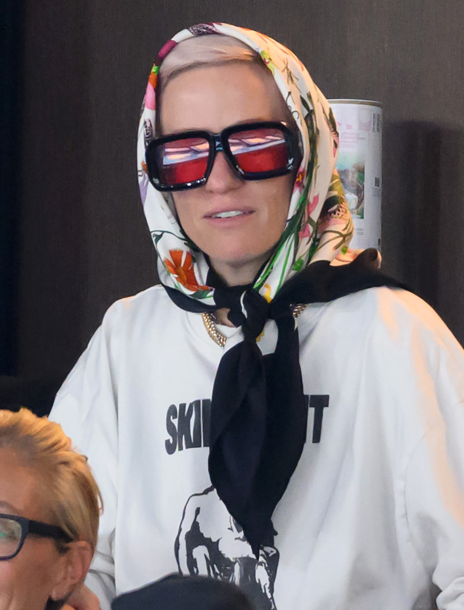 Megan Rapinoe wearing a headscarf and sunglasses