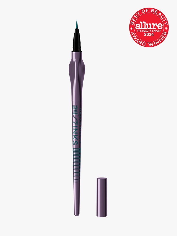 Urban Decay 24/7 Inks Liquid Eyeliner component in purple with green accents on a light gray background with red Allure Best of Beauty seal in the top right corner