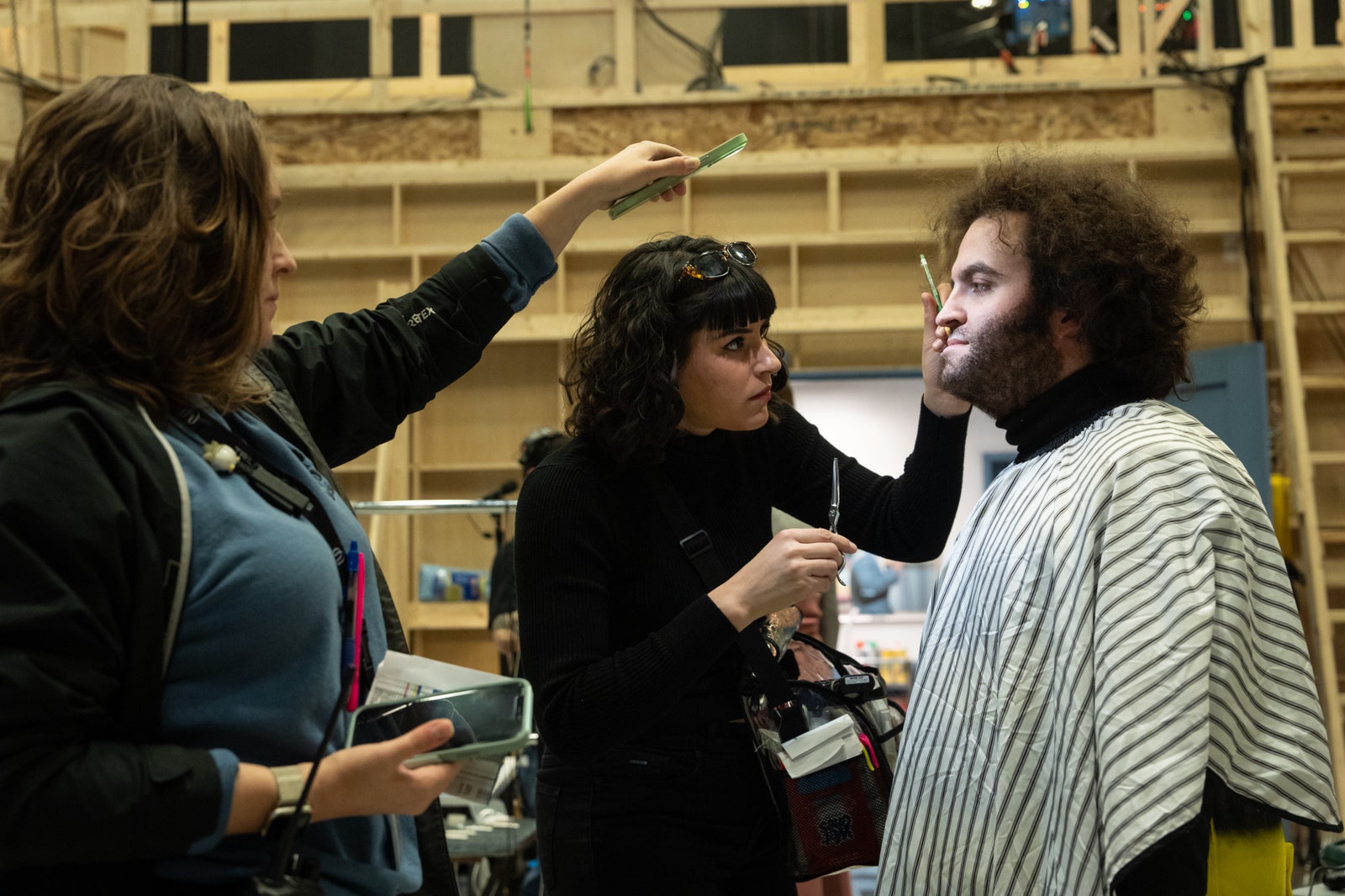 Hair  Makeup team doing touchups on Matt Wood on the set of Columbia Pictures' SATURDAY NIGHT.