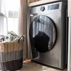 Basket with dirty laundry on floor