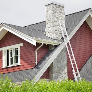 Ladder against house with chimney