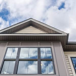 Clouds reflect in striking black vinyl windows