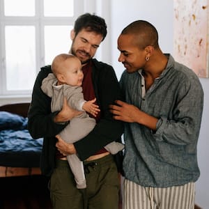 Fathers leaving bedroom with son