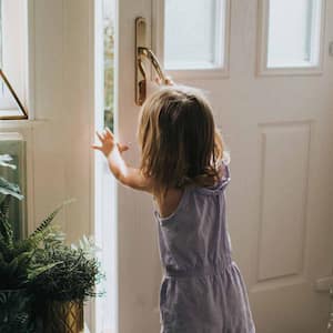 Girl opening a door