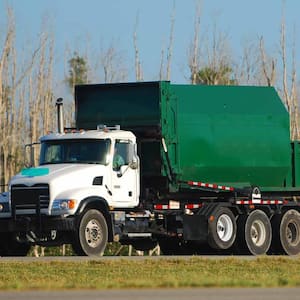 Green garbage truck