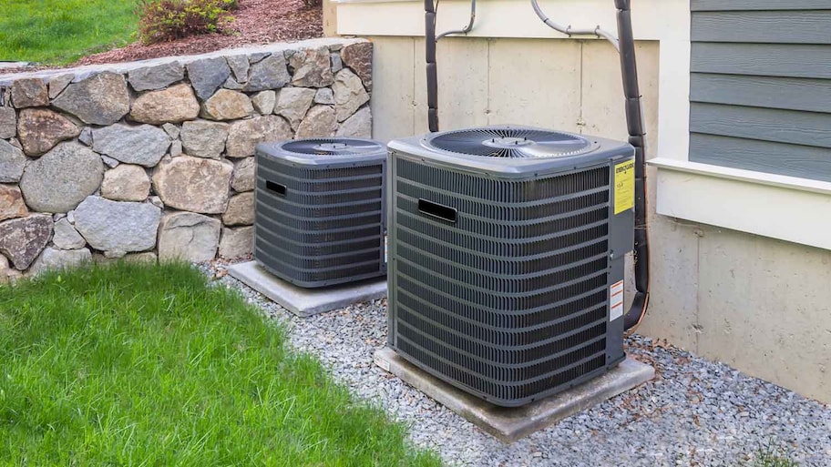 Residential air conditioner units installed in the yard