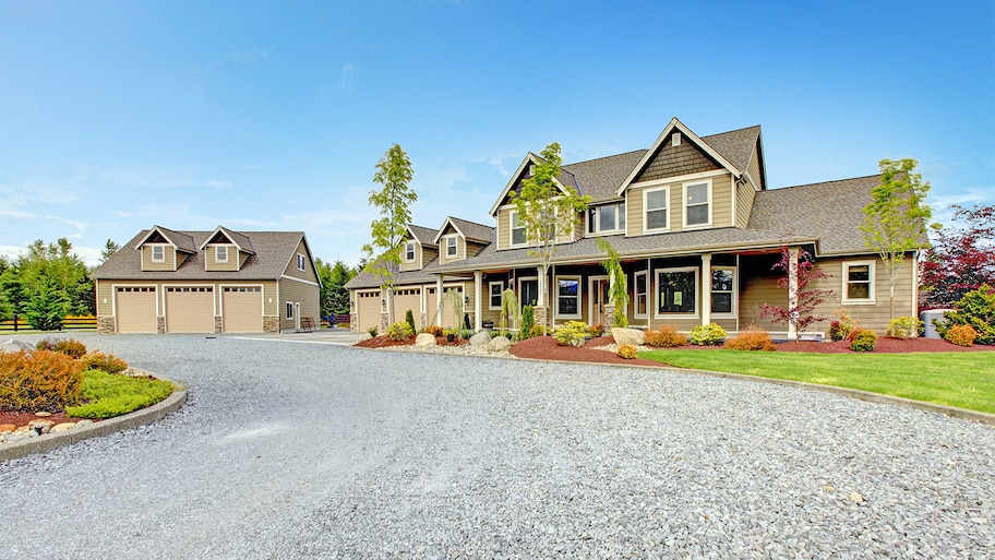 Home with long gravel driveway