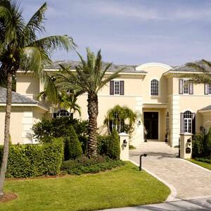 Large home with palm trees