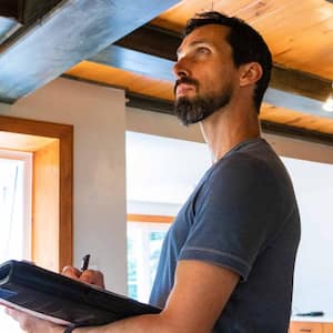 Man inspecting a house