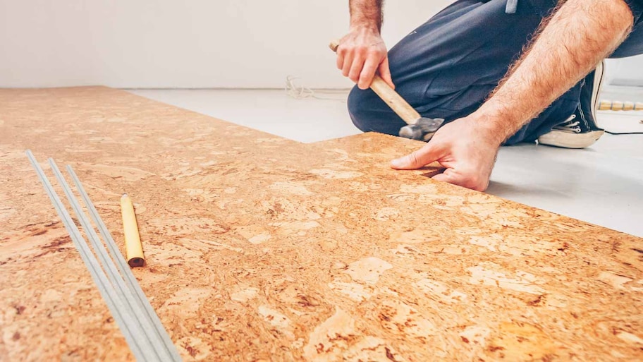 Man installing cork floor