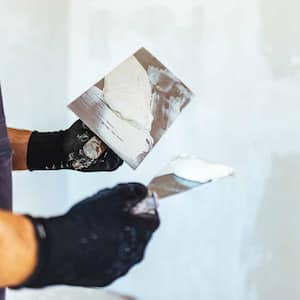 Man plastering a wall