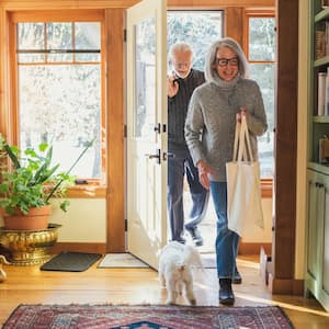 Man and woman arriving home