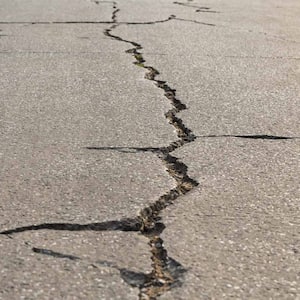 Surface of concrete driveway with crack